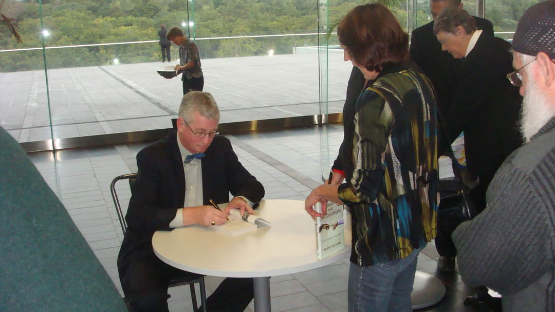 Book signing: Affixing of a signature to a book by its author