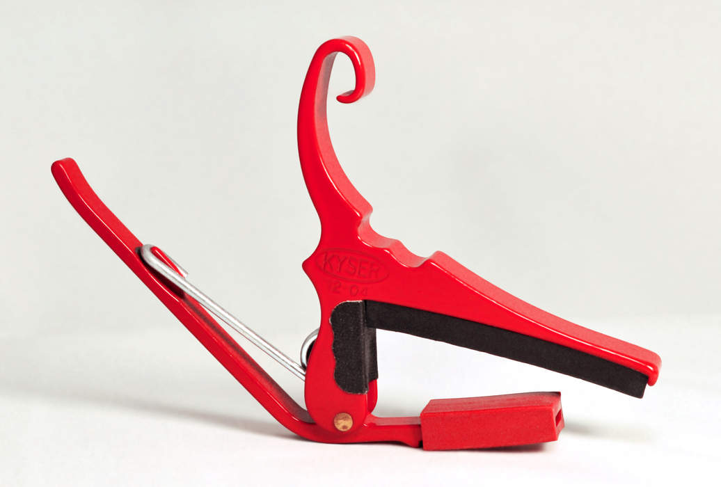 Capo (musical device): Common tool for players of guitars and other stringed instruments