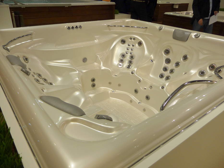 Hot tub: Large tub for hydrotherapy or pleasure